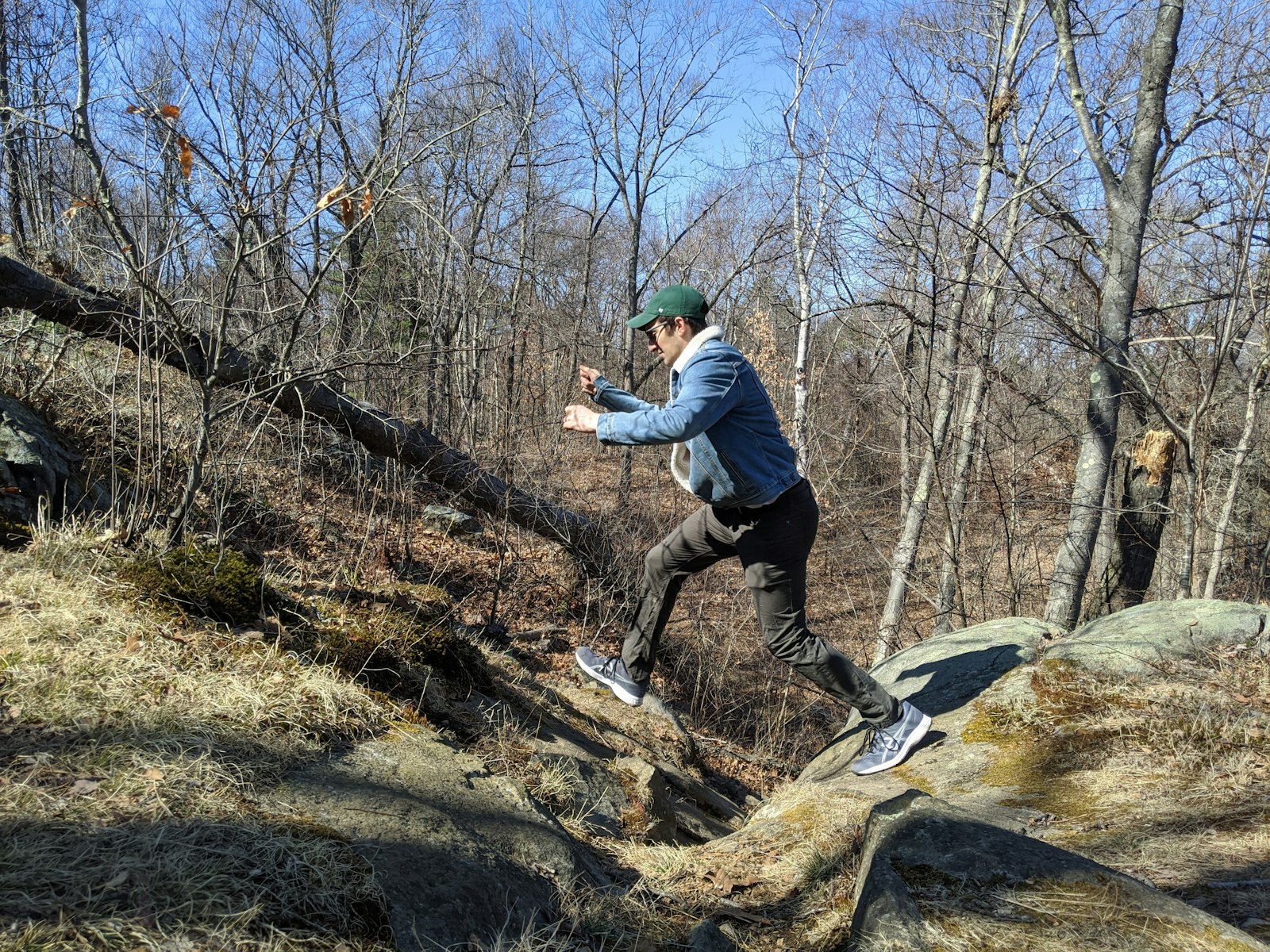 Max jumping from rock to rock on a hike